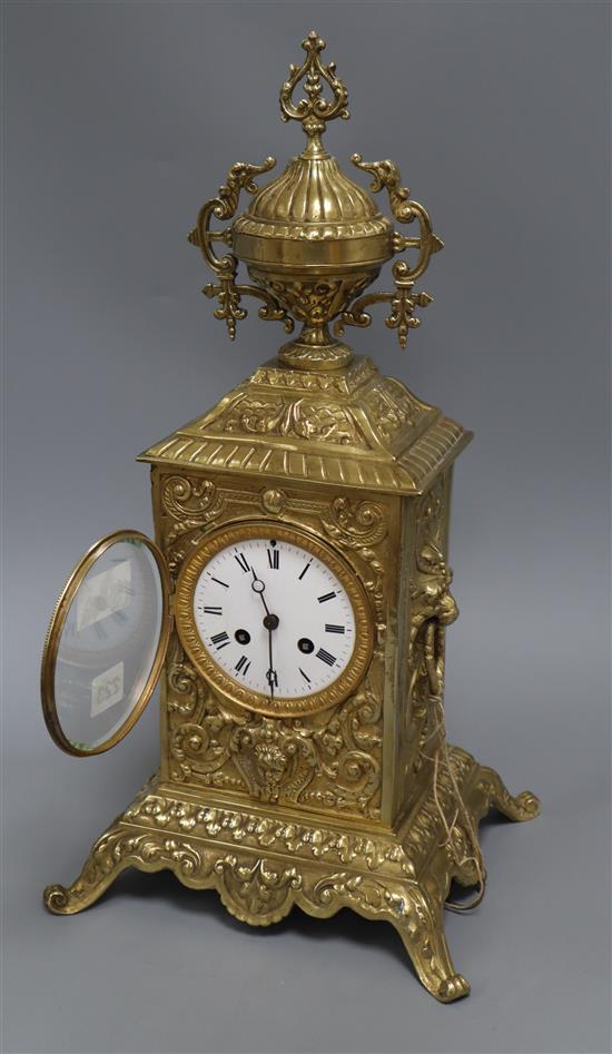 A cased brass mantel clock height 47cm